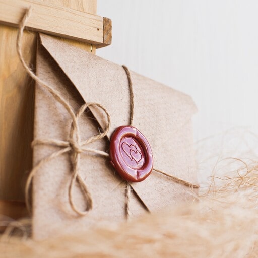Use wax seal stickers on wedding favors