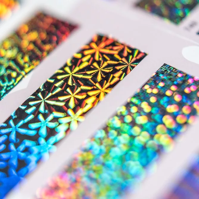 Irregular lines on holographic printing create a 3-D effect