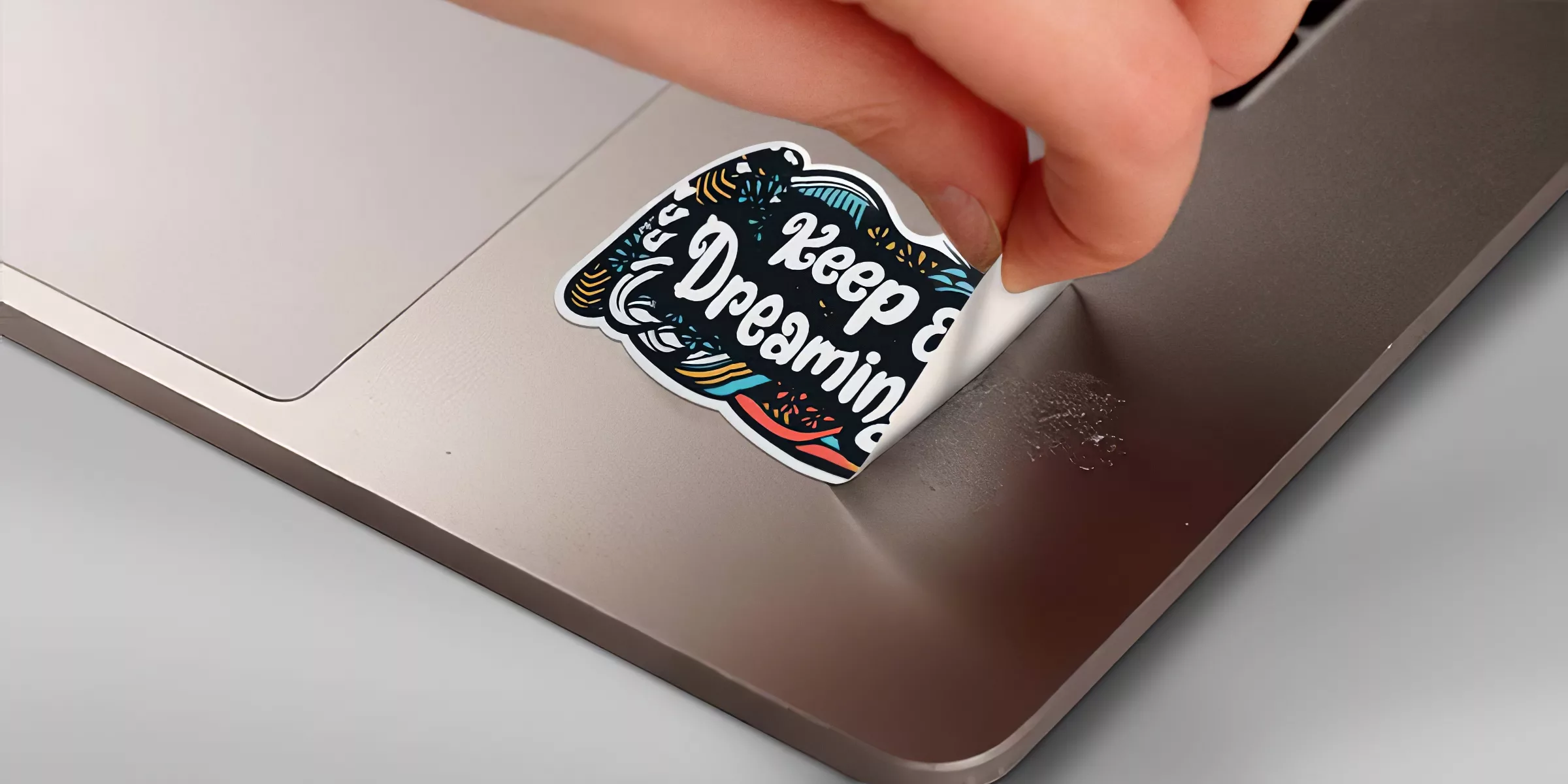 How to remove stickers from a laptop