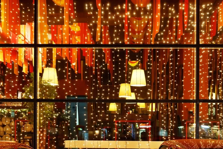 Illuminating your store's window with twinkling festive lights