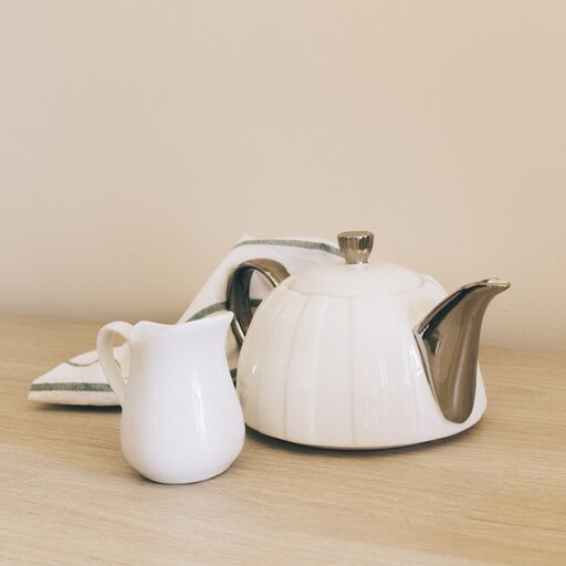 A kettle or a tea pot will be the perfect for large amount of drinks