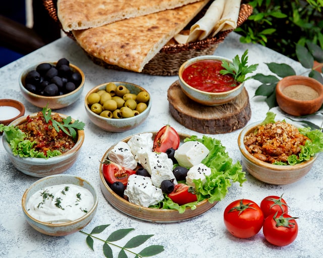 Serve Greek mezze platter at Mamma Mia parties