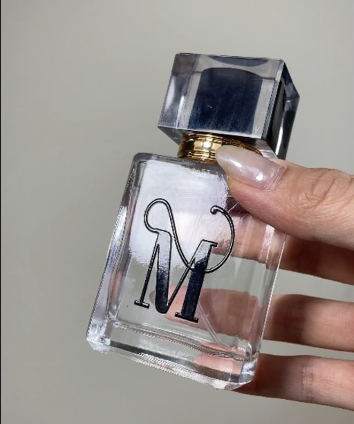 A Perfume Bottle Personalized with their Initial is the best gift for a coworker