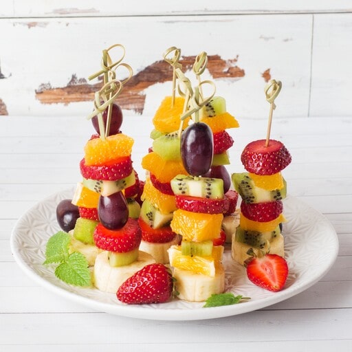 Serve something refreshing and light like fresh-fruit skewers