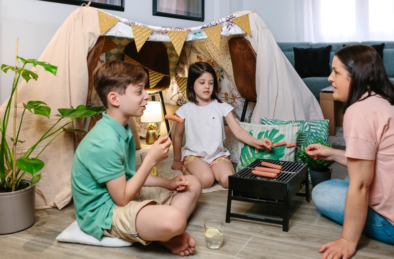 Sleepover party for kids in camping theme