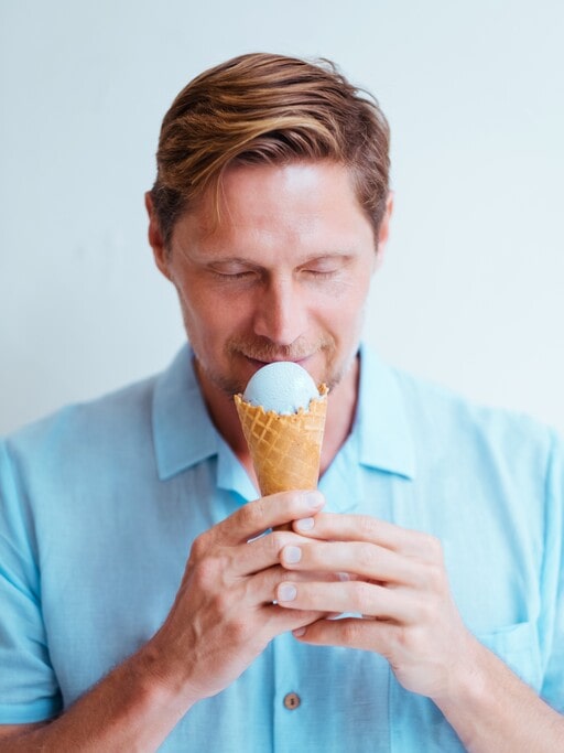 Ice Cream Party: 5 Unexpected Ways to Host a Cool One This Summer 5 A man is tasting ice cream