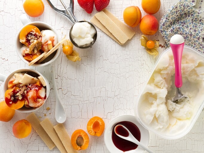 Ice Cream Party: 5 Unexpected Ways to Host a Cool One This Summer 2 DIY sundae bar with a variety of sauces and toppings