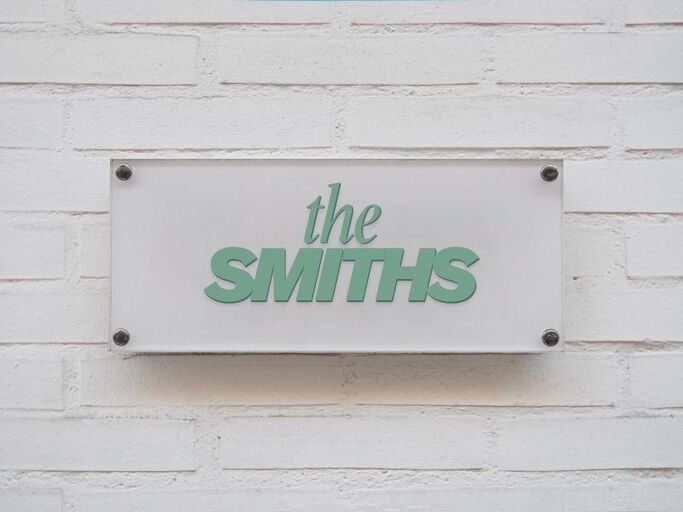 15 Personalized Housewarming Gift Ideas That Say "This Is Home" 3 Custom Name sign for front door