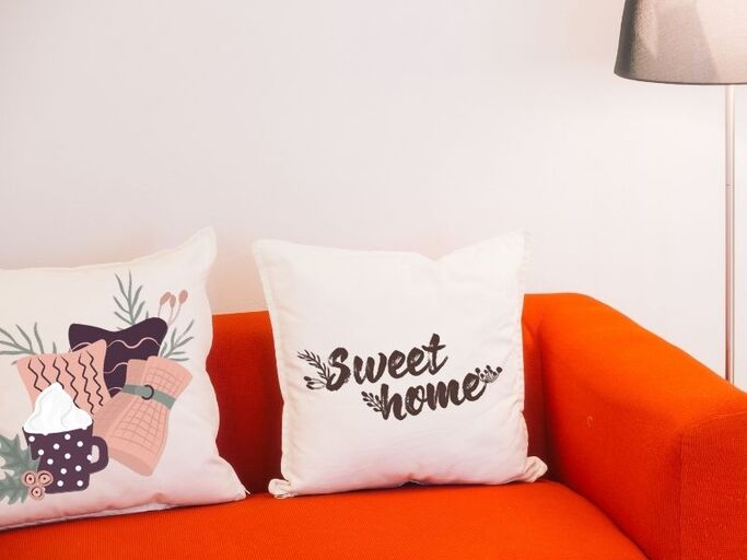 15 Personalized Housewarming Gift Ideas That Say "This Is Home" 4 Customized sofa pillows with DTF transfers