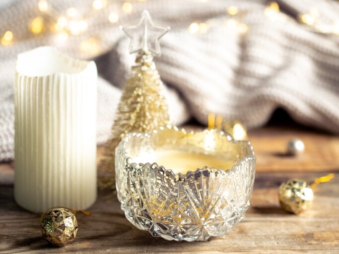 Candle in gold or silver jar 