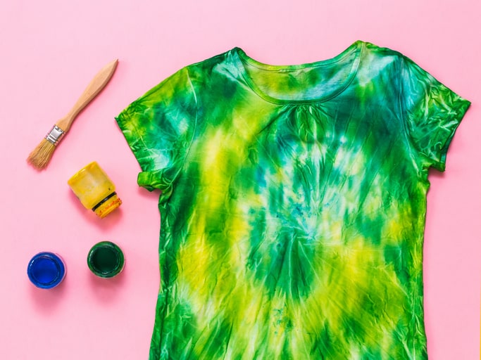 Green tie-dye on a yellow base shirt