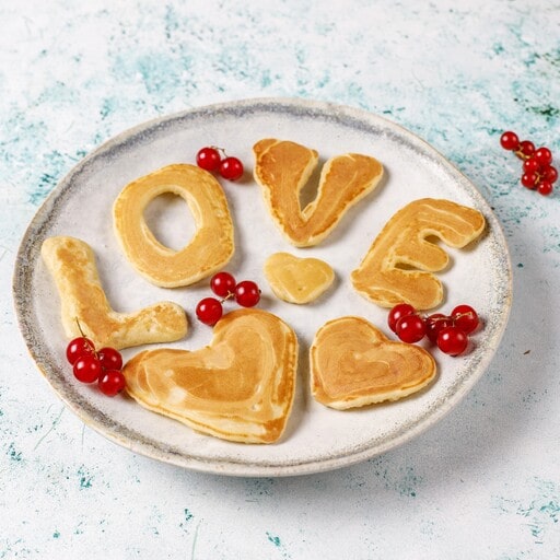 Heart-shaped breakfast pancakes for him